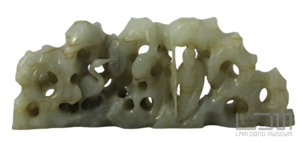 A carved stone sculpture of a personDescription automatically generated